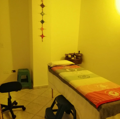 Therapy room with massage table and mandala — Sananda Reiki